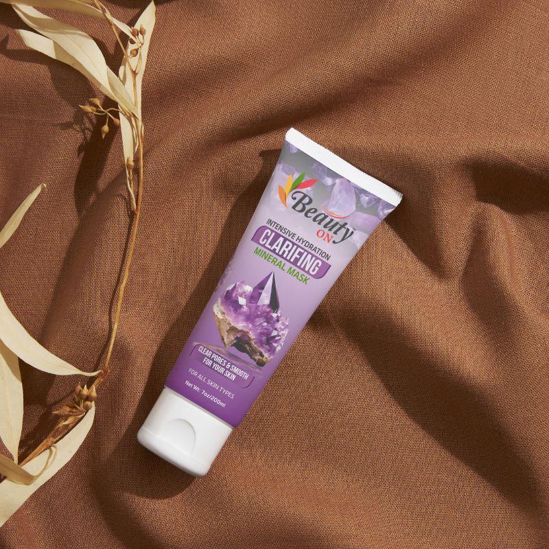 Clarifying mineral mask for all skin types, sulfate-free skincare product on brown fabric background