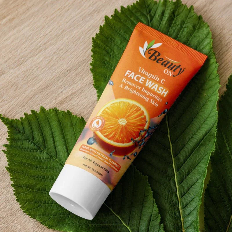 Vitamin C face wash for all skin types, brightening & impurity removal, natural ingredients, on green leaf